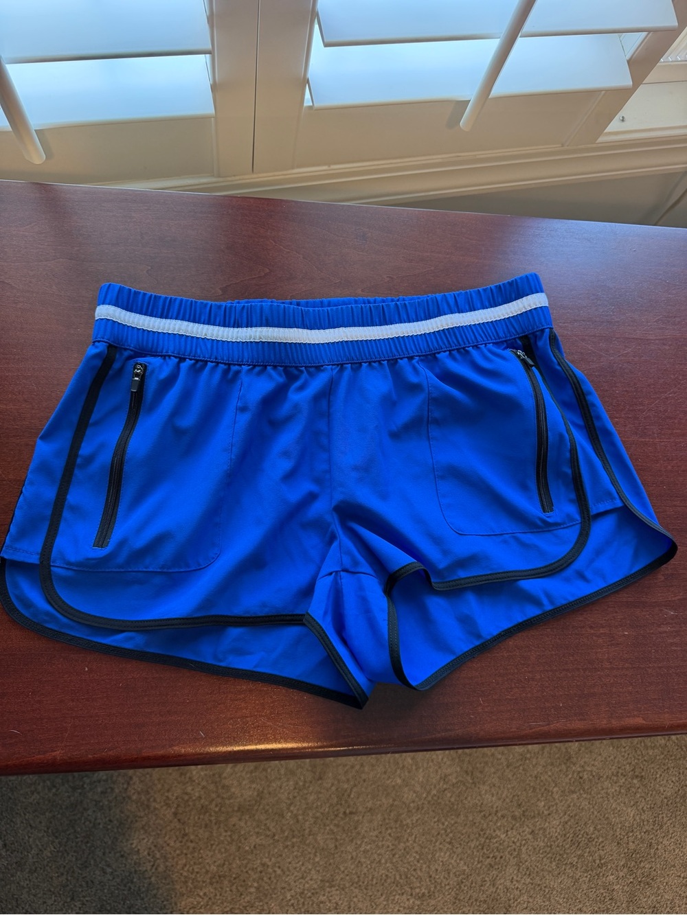 Fabletics Royal Blue Athletic Shorts with White Striped Waistband and Black Trim